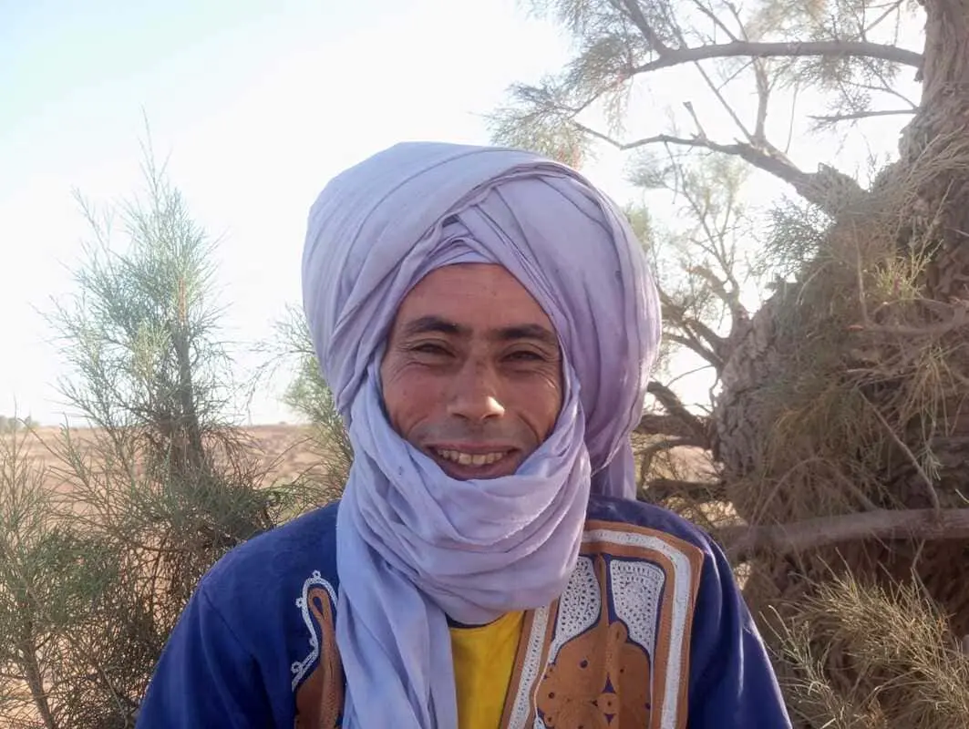 Smiling portrait of Moubarak, Sahara chamelier