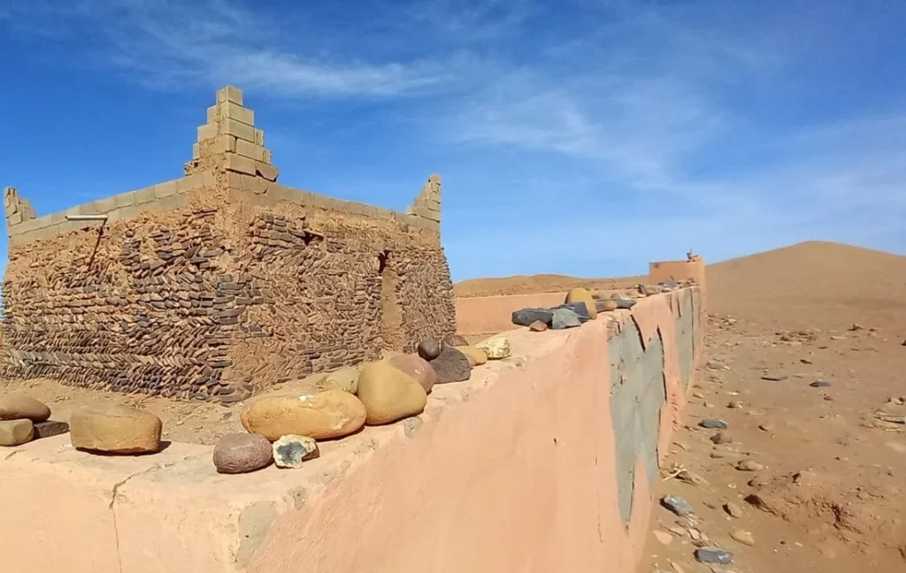 Visit to the Sidi Naji marabout during a 6-day 4x4 journey in the Moroccan Sahara with ADN Sahara, a spiritual place surrounded by dunes and stones
